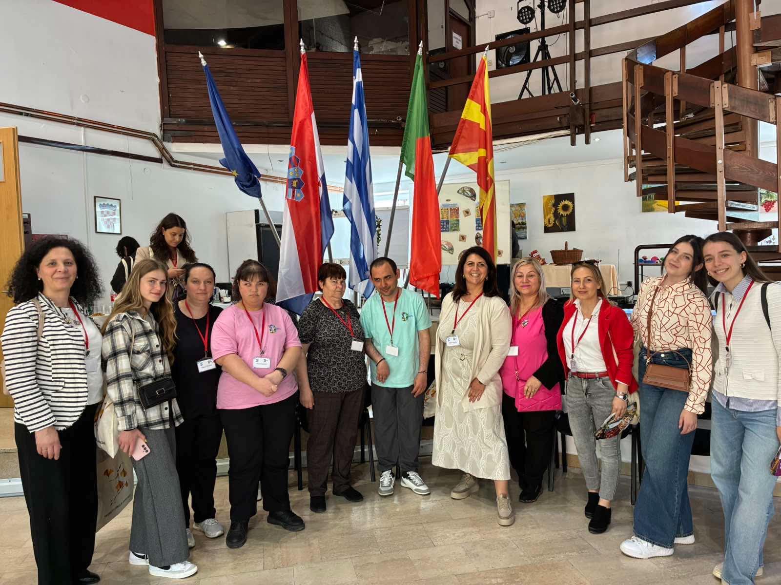 Participants from D (special) DAYS partner countries gathered in front of national flags during the Special (Olympic) Games in Daruvar